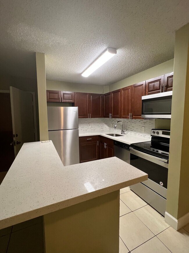Building Photo - Updated 2 Bed, 2 Bath 1st Floor Condo with...