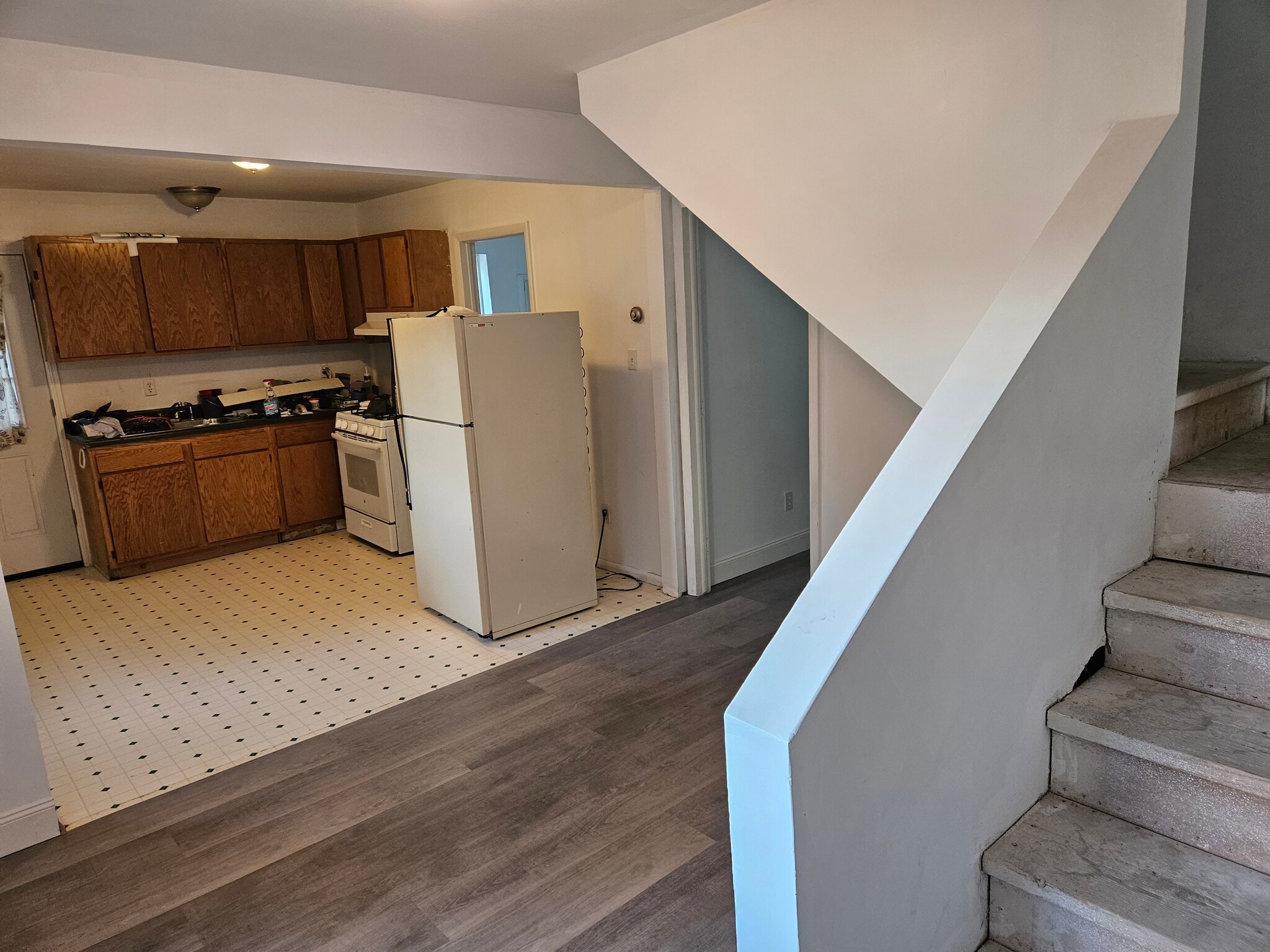 Standing at the stairs looking back toward the kitchen. Sorry about the tools, we are in the last da - 4304 Kateri Ln