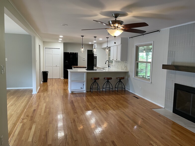 Spacious kitchen with/fridge, oven, electric stove, dishwasher, and counter top seating - 8205 Ainsworth Dr