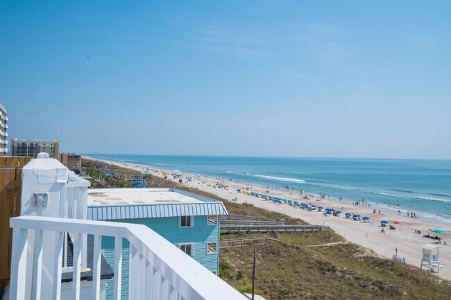 Building Photo - SPEND YOUR OFF-SEASON AT THIS TOP FLOOR OCEANFRONT CONDO