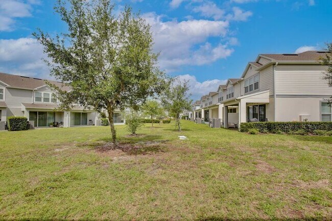 Building Photo - Immaculate Townhome · Dual En-Suite Bedrooms + Flex Loft · Cable & Internet Included · 3.5 Miles ...