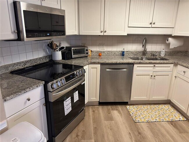 Building Photo - LIFE'S A BEACH- FULLY FURNISHED at the Nau...