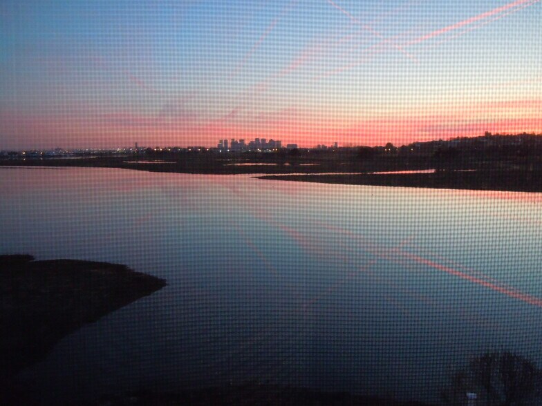 sunset on the marsh and inlet looking southwest to downtown Boston skyline - 103 Summer St