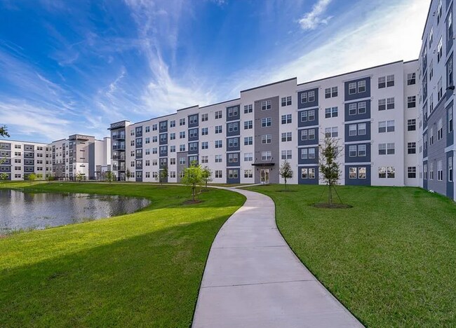 Building Photo - Top Floor Corner Unit – Brand New 3/2 Condo with Balcony in Millenia Park *** Only $1995/mo ***