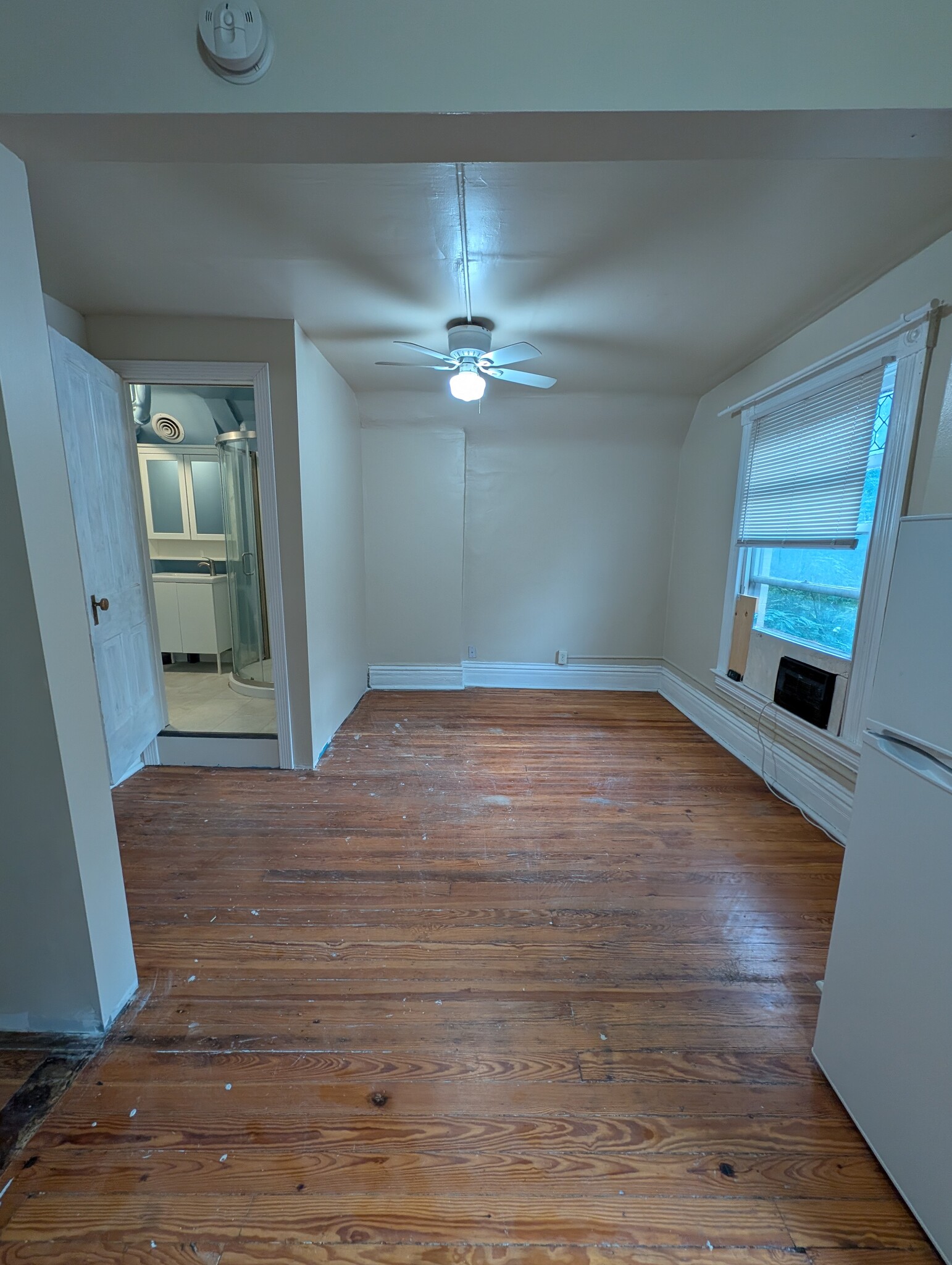 View from kitchen looking towards bathroom door and bedroom/living room area - 1280 Race St