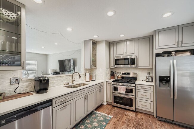 Building Photo - LOCATION, LOCATION! Featuring modern finishes and a peaceful outdoor retreat, this 2-bed 2.5-bath...