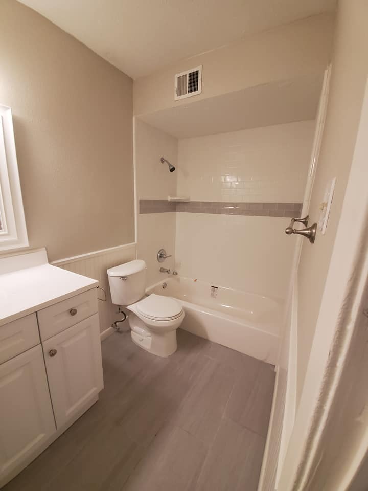 New tub, tile, flooring, and toilet! - 6450 Lontos