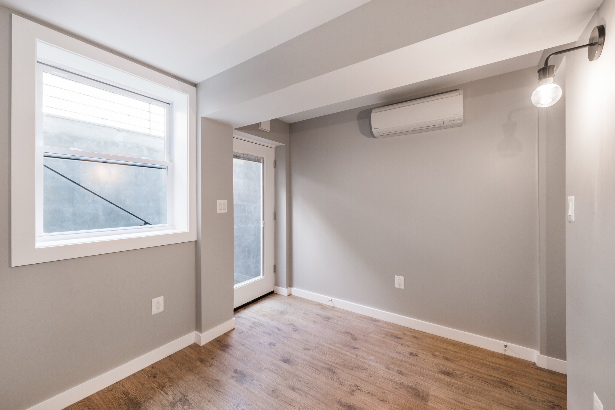 bedroom with heating/cooling unit - 523A Irving St NW