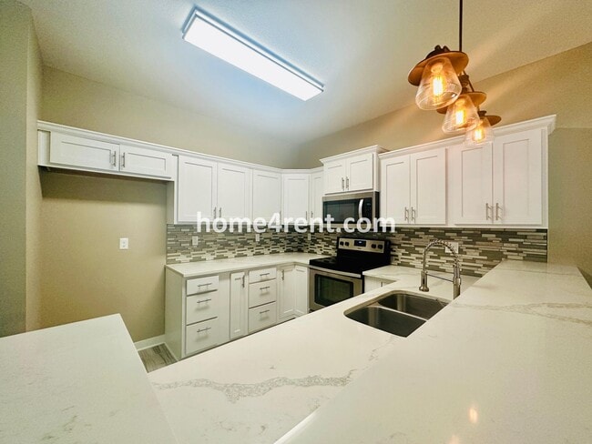Building Photo - Ranch Style Home w/ Updated Kitchen, including SS Appliances and Granite Counters Plus a Large Un...