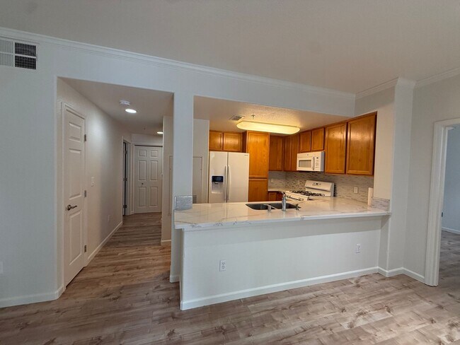 Building Photo - 2 bed | 2bath | 1039 SF | Private Garage & Assigned Parking | Downstairs unit |Owners pays for WS&G!