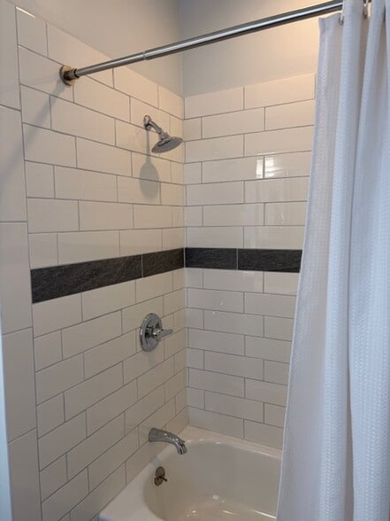 All-new tile and tub. - 623 Pierce St NE