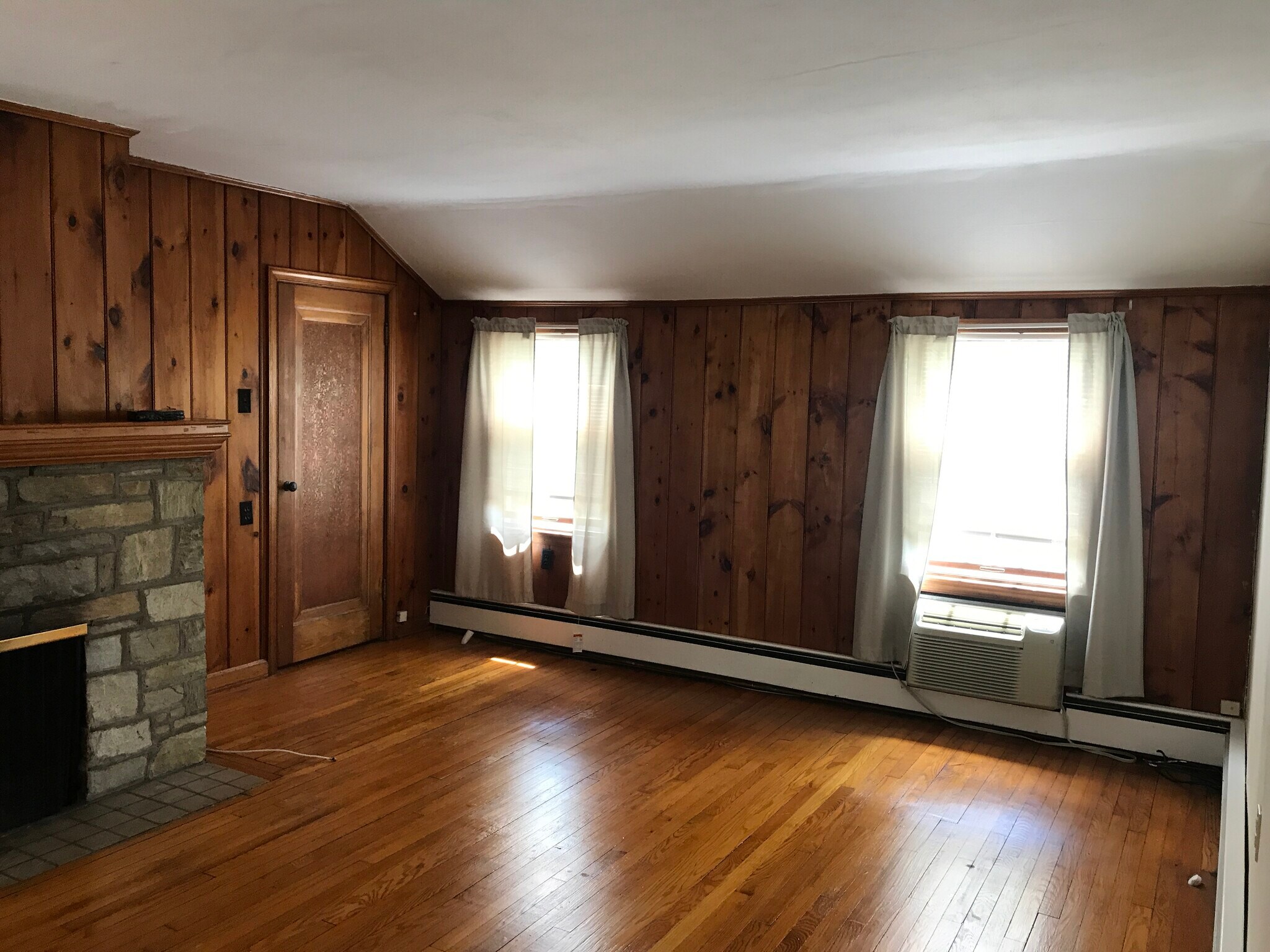 Door to right of fireplace leads to attic with amble storage. - 106 Morgan Ave