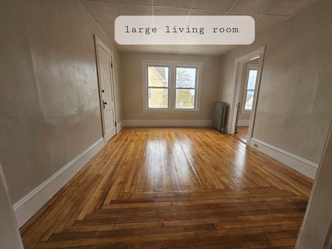 Large living room with refinished hardwood floors - 252-3 Laurel St