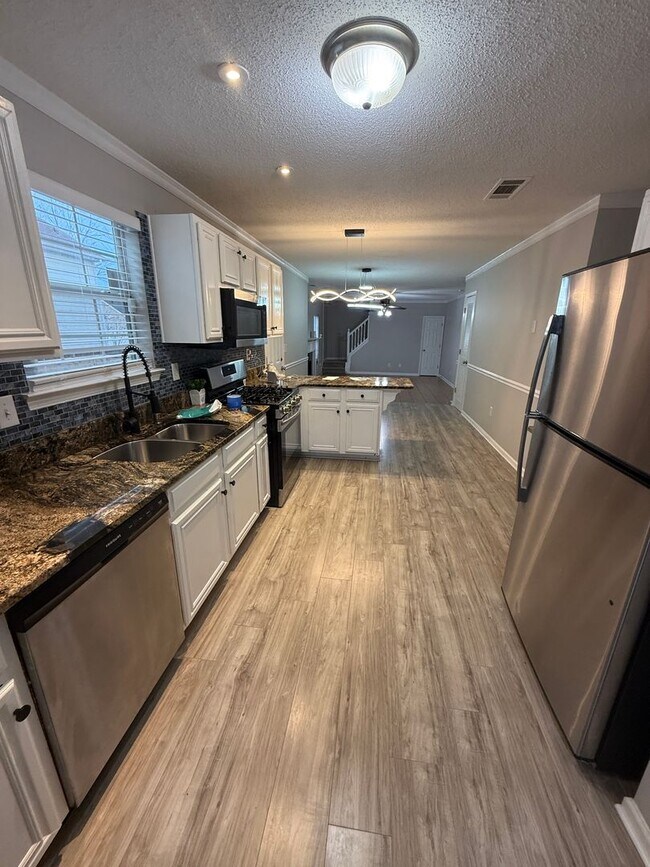 Building Photo - Spacious 5 Bedroom Home with Flexible Living Space & Huge Backyard