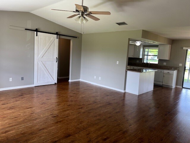 Easily separate the primary bedroom from guests rooms with this stylish barn door! - 2321 SE 5th Ct