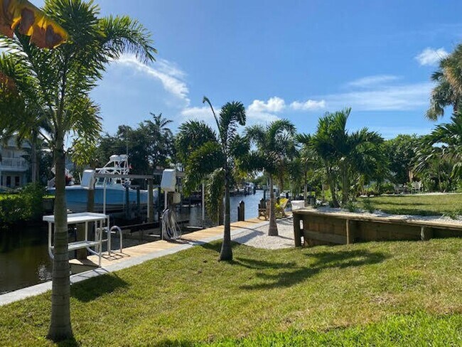 Building Photo - Palm City Home with Dock and Lift