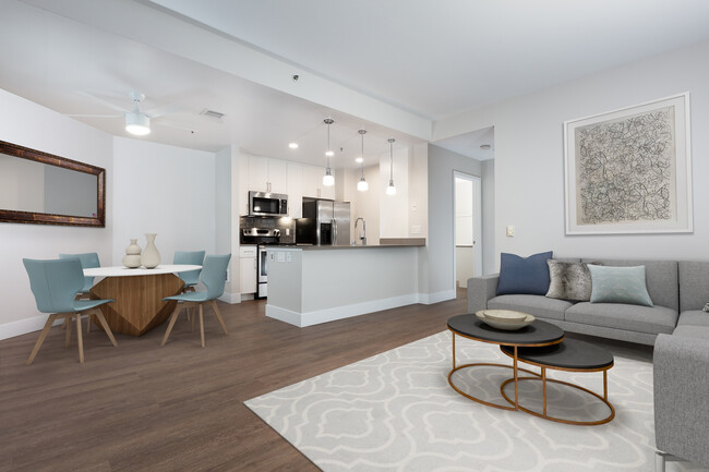 Renovated Phase I kitchen with quartz countertops, tile backsplash, and stainless steel appliances - Avalon at Mission Bay