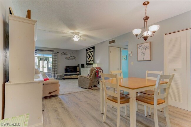 Building Photo - 55+ Charming first-floor condo nestled in ...