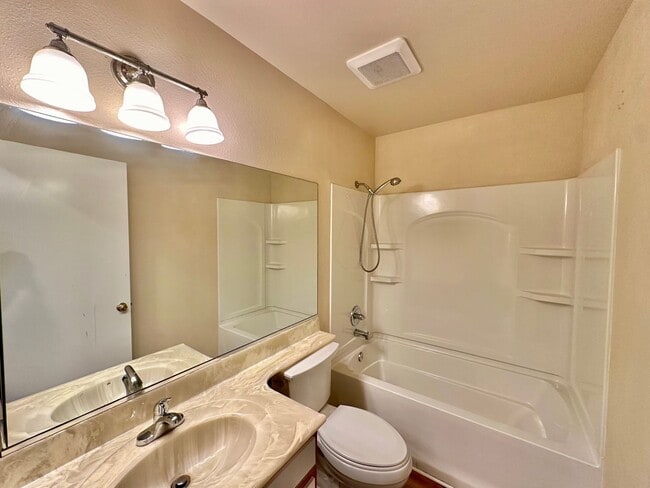 Building Photo - Remodeled 4 bedroom with central A/C and 2 car garage!