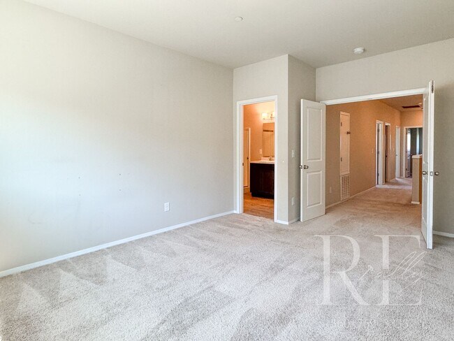 Building Photo - Modern End-Unit Townhome with Private Fenced Yard, Gourmet Kitchen & Spacious Layout