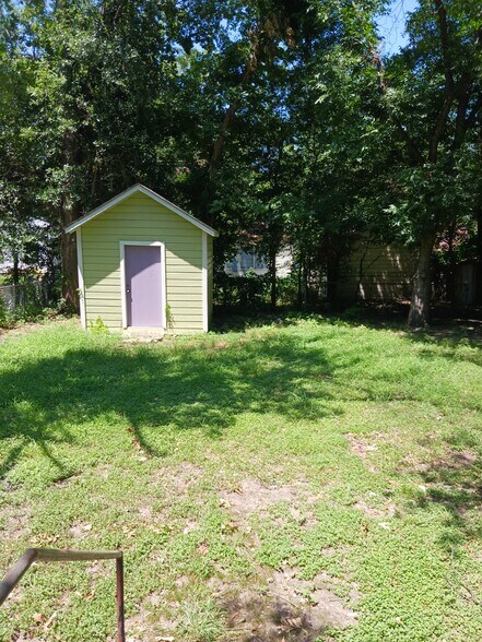 Huge backyard with spacious, secure shed. - 1012 N 23rd St
