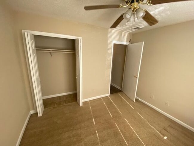 Building Photo - NOW AVAILABLE! Charming 2-Bedroom, 2-Bathroom Single-Level Townhome