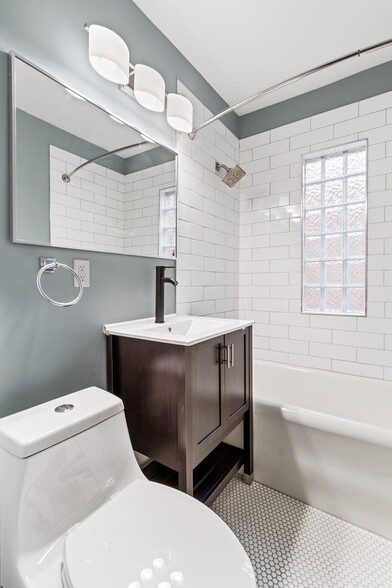 Updated Bathroom with new fixtures and ceramic subway tile - 1802 E Long St