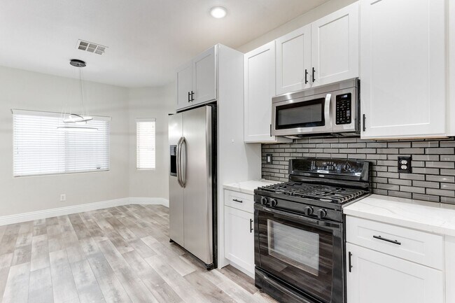 Building Photo - Modern Two-Story Home with Stylish Kitchen...