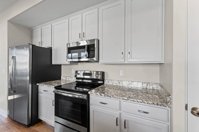 Building Photo - Upgraded 4-Bed Townhome with Finished Base...