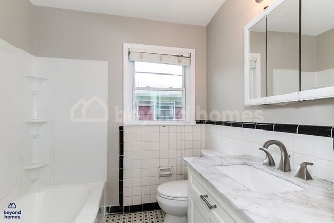 Building Photo - Updated Bungalow with Massive Deck and Fully Fenced Yard!