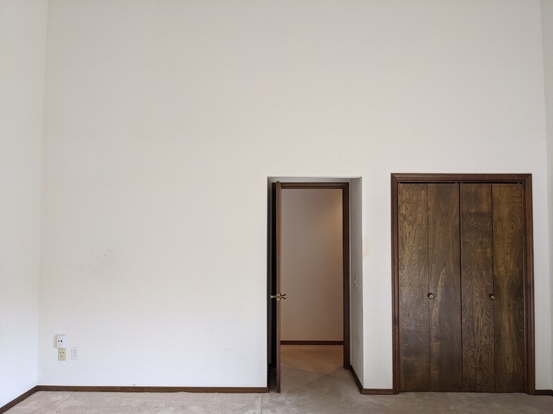 master bedroom with one of two closets - 205 N Easy St