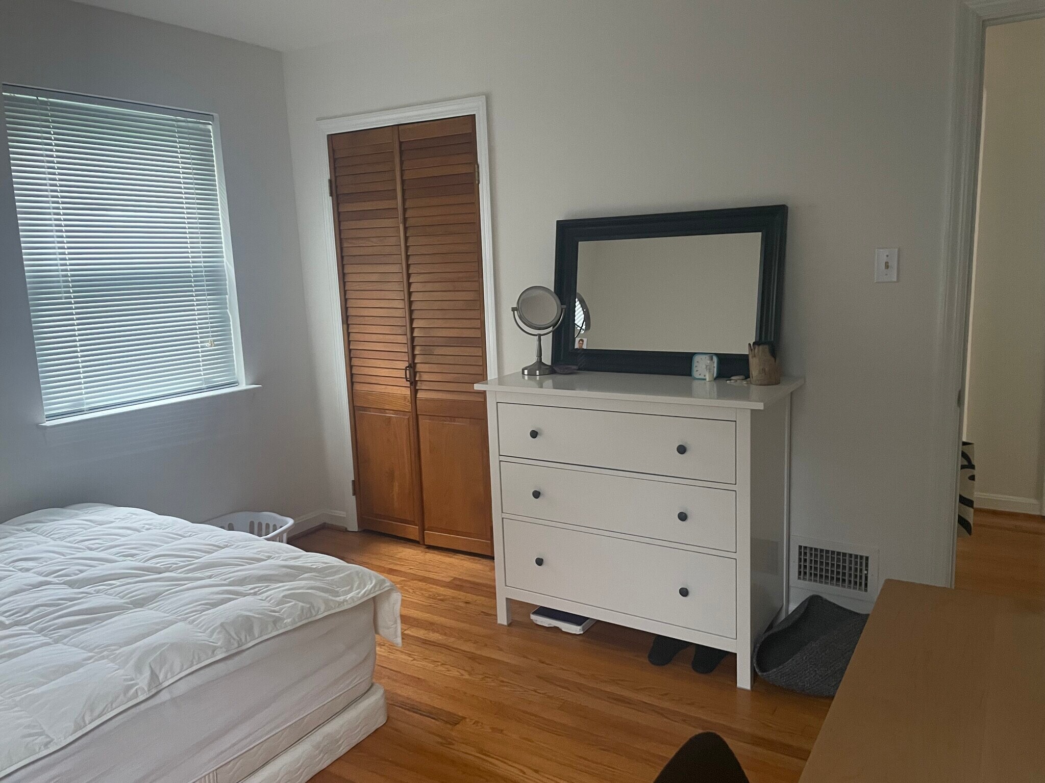 Bedroom 1 has wood floors and 2 windows. - 9707 Bristol Ave