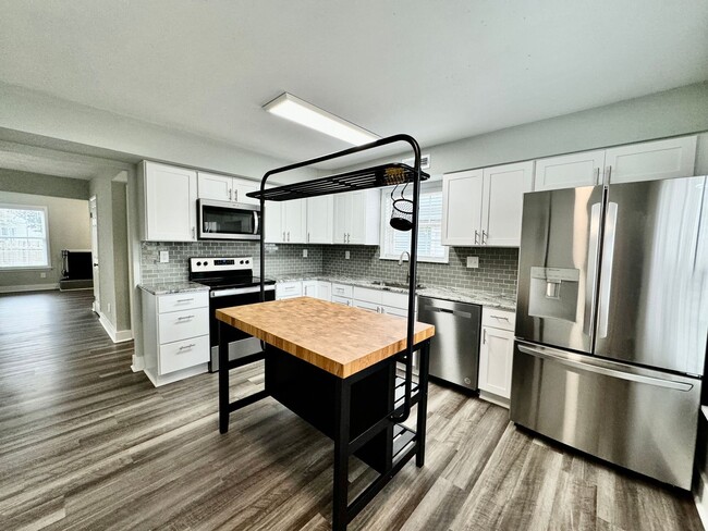 Building Photo - Updated & Ready For You NOW! A Pet-Friendly Home w/Attached Garage, All Appliances Convey - HUGE ...