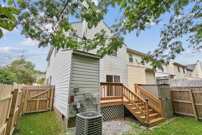 The home offers a large back deck, storage shed, and fully fenced backyard - 1644 Skiffes Creek Cir
