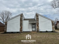Building Photo - Quiet 3BR/2BA Cove Near Southwind | Soaring Ceilings & Floor-to-Ceiling Stone Fireplace