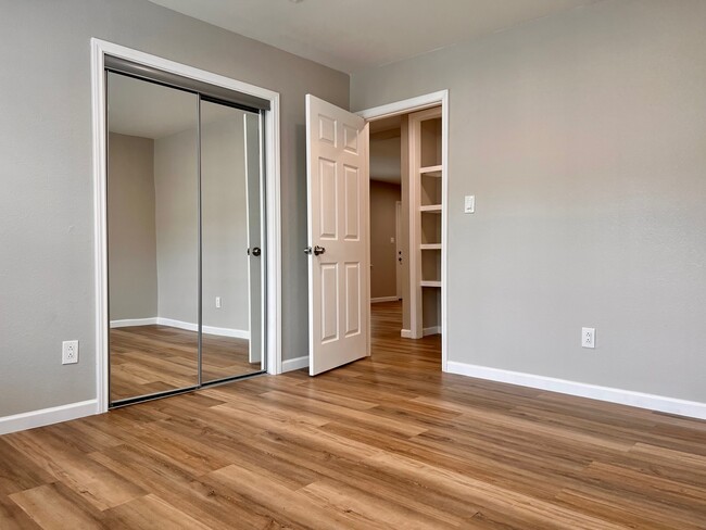 Bedroom 1 with sliding mirror closet door - 1266 Dove St