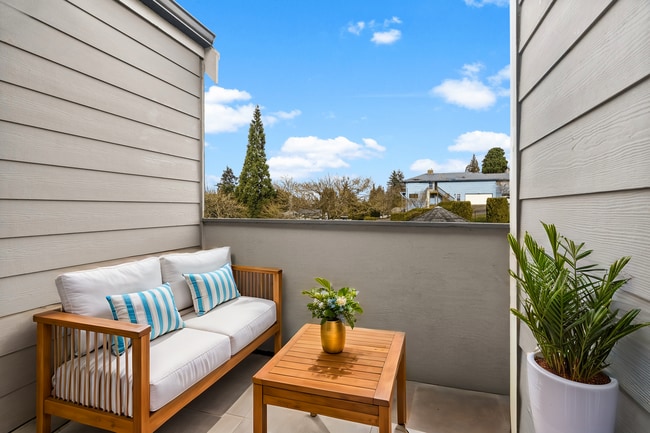 Relax and unwind on your own private balcony, offering comfort and a picturesque view. - Monte Vista Apartments