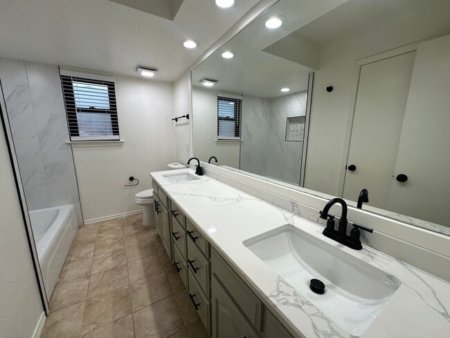 Building Photo - PLANO 4-bed 3-bath 2-car garage with huge workshops