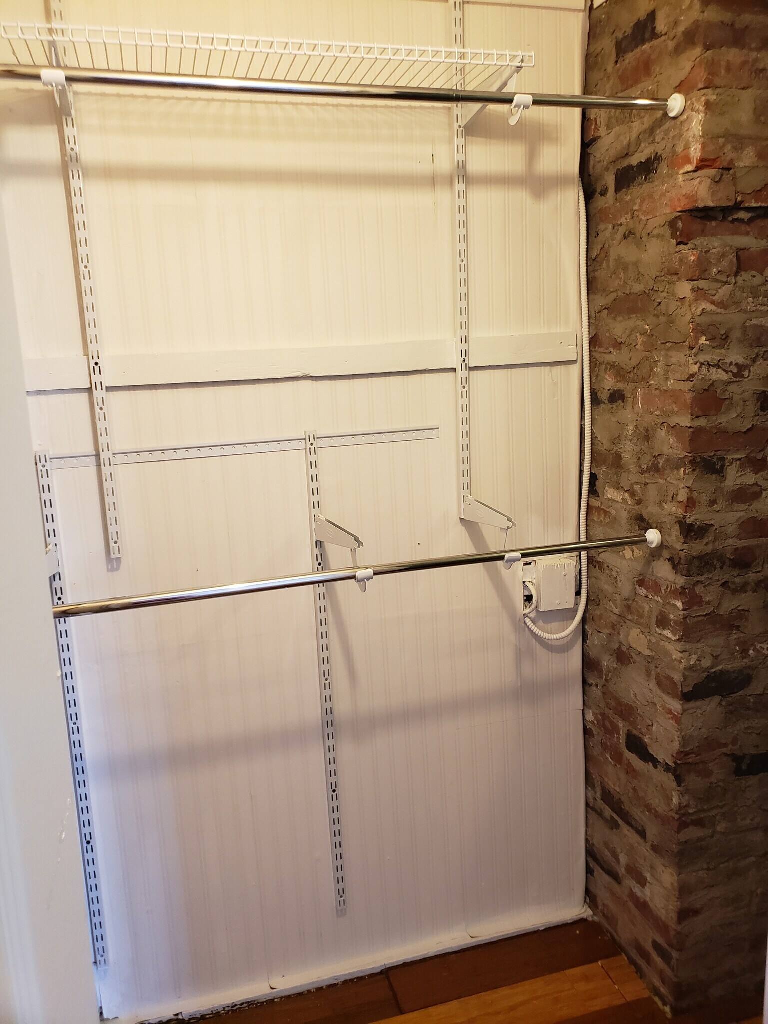 Two rods for hanging clothes and exposed chimney detail. - 10106 Wingfield Rd