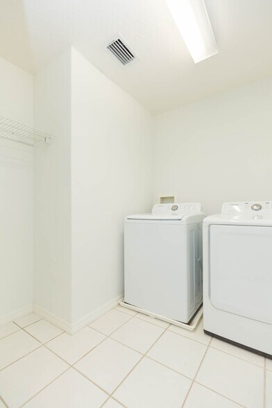 Upstairs laundry/dryer with hanging space and linen closet - 18135 Nassau Point Dr