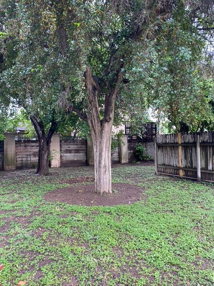 huge fenced backyard. - 609 N 15th St