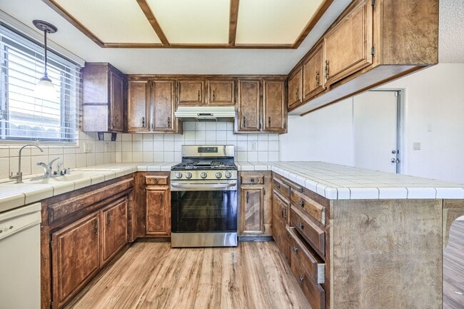 Building Photo - 3 bedroom, 2 bath with large living room and brick fireplace.  Good size kitchen with tons of cab...