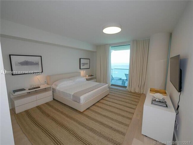 Building Photo - 10201 Collins Ave