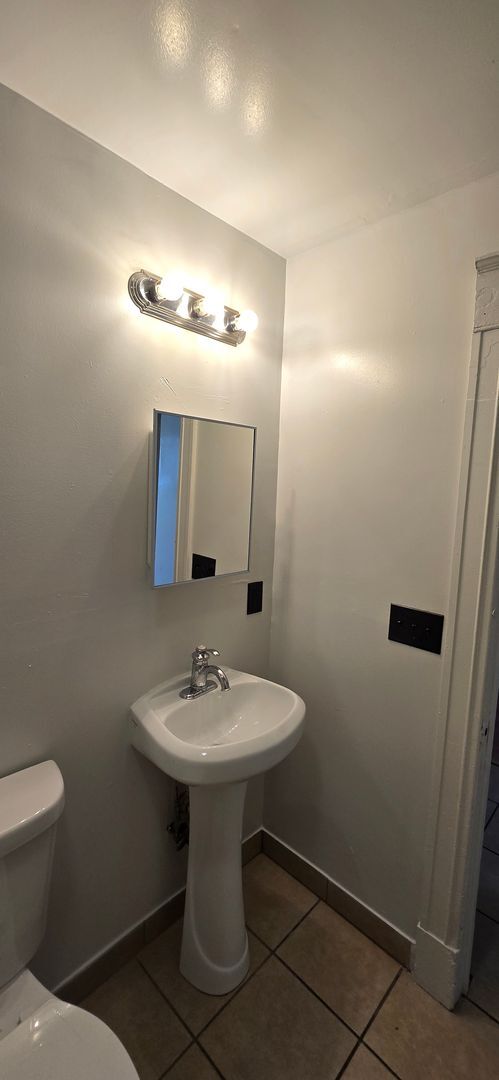 Building Photo - Large remodeled 4 bedroom with off street parking available