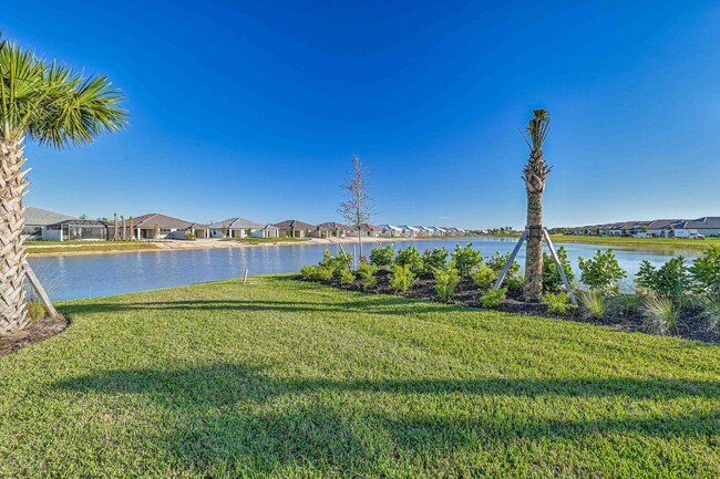 Building Photo - **Coach Home w/ Private Pool in Esplanade Lake Club **