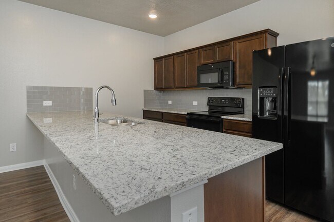 Building Photo - Live, love, and grow in this charming townhome!