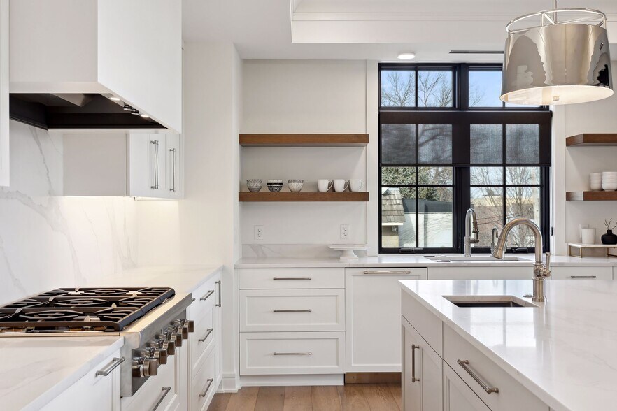 The kitchen boasts generous cabinet and counter space - 511 2nd St