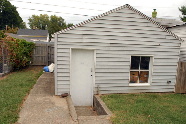 This is an old picture of the 1-car garage. There is a 6ft. wooden fence on the left now. - 1103 Charles St