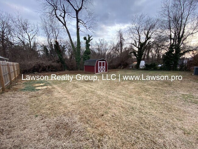 Building Photo - Well Maintained Three Bedroom with Fenced Yard and Shed