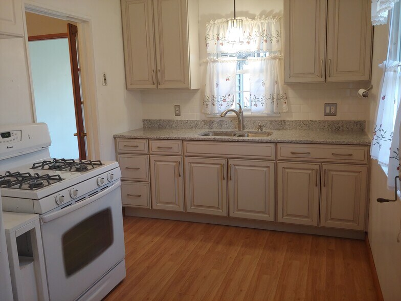 Kitchen, facing sink and counter. - 7415 1st Ave S